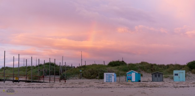 Zonsopkomst en regenboog bij Kaap Noord Texel